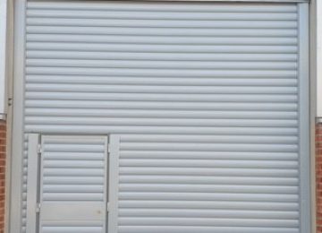 Shutter with wicket door Shutter with wicket door